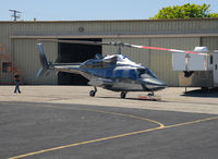 N222EX @ REI - The only thing cooler than this helicopter is the remote controlled tug. I wish I had a video of him backing it into the hangar. - by Marty Kusch