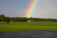 C-GINS @ CYCC - A dark sky and a rainbow serve as a beautiful backdrop for C-GINS as it readies to depart into clear skies to the west. - by Skylane77