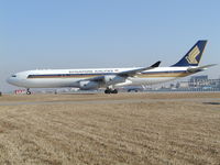 9V-SJN @ ZBAA - Holding short runway - by ghans