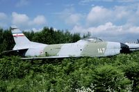 14307 @ LJLJ - When the Yugoslav civil war broke out, the Serbians left Brnik air base, but left behind this F-86D. In 1998 it was still in place, although nature tried hard to get hold of this storage area. - by Joop de Groot