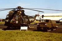 ZA297 @ EGLF - Royal Navy Sea King helicopter coded VG/B of 846 NAS. Seen at Farnborough in 1980. Scanned from slide, shift of colour (helicopter and Volvo BV202E are painted dark green) - by Roger Winser