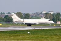 N404VL @ EGBB - 2001 Bombardier BD-700-1A10 taxies out through the heat haze at Birmingham - by Terry Fletcher