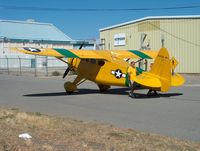 N5553N @ KMHV - Being pused over public road