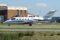 G-EDCS @ EGGW - Raytheon 400A taxies in at Luton - by Terry Fletcher