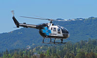 N8118Y @ KCCR - CALSTAR 1989 BO105LS lifting off for training flight - by Steve Nation