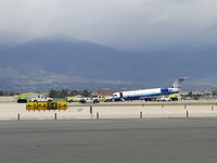 N925SW @ ONT - Fire, Police, and Airport personnel surveying the Sky West, United Connection aircraft incident on runway 26L - by Helicopterfriend