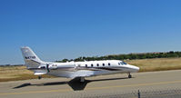 N47HF @ KCCR - 2003 Cessna 560XL taxying for take-off with thrust reversers extended to acknowledge two waving 3-year old kids at fence! - by Steve Nation
