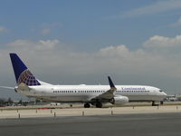 N38417 @ ONT - Stopped awaiting clearence to cross runway 26L to go to terminal - by Helicopterfriend