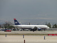 N105UW @ ONT - Taxiing to terminal north of runway 26R - by Helicopterfriend