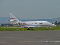 N676BA @ KAPC - 2001 Dassault Falcon 2000 leaving Napa, CA (KAPC) for mystery location with Napa River RR Bridge in background - by Steve Nation