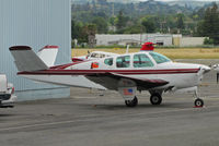 N9340Y @ KCCR - 1960 Beech M35 with 'El Faro' titles and lighthouse logo in for maintenance at Buchanan Field (Concord, CA) - by Steve Nation