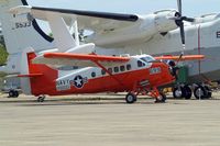 144672 @ KNPA - DHC NU-1B Otter [160] Pensacola NAS~N 10/04/2010. Parked in the storage area of the National Museum of Naval Aviation. Sheltering here under the wing of the Martin SP-5B Marlin. - by Ray Barber