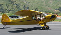 N33112 @ SZP - 1940 Piper J3C-65 CUB, Continental C90 90 Hp upgrade, taxi off the active - by Doug Robertson