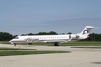 N605QX @ KRFD - CL-600-2C10