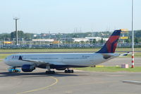 N803NW @ EHAM - Being towed across Schiphol this A330 recently changed livery from Northwest Airlines to Delta Air Lines. - by Henk van Capelle