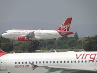 N530VA @ LAX - N530VA landing on runway 24R while N630VA awaits to take off on runway 24L - by Helicopterfriend