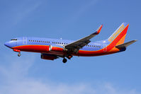 N608SW @ LAS - Southwest Airlines N608SW (FLT SWA1298) from Tucson Int'l (KTUS) on short final to RWY 25L. This aircraft was delivered to Southwest in 1995, and the winglets were added sometime in 2009.