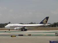 9V-SPA @ LAX - Starting take off roll westbound from runway 24L - by Helicopterfriend
