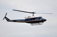 69-6633 @ KADW - 1st HS Twin Huey photographing the crowd line at Andrews AFB Open House '10. - by TorchBCT