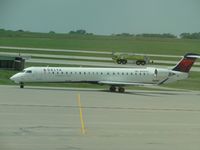N926XJ @ MCI - Taxiing to terminal passing Emergeny Crew - by Helicopterfriend