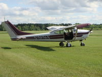 N2076X @ 4WI0 - This plane has been specially modified to accommodate skydiving with the removal of unneeded seats and the addition of a gull-wing exit door. - by Malcolm Paine