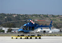 N618AC @ CMA - 1997 Bell 407, one Rolls Royce (Allison) 250-C47 Turboshaft with FADEC, 814 shp for takeoff, 700 shp continuous. Max hook capacity 2,645 lbs. Max takeoff with internal load 5,000 lbs. Max takeoff with sling load 5,500 lbs. At SUN AIR JETS ramp on dolly - by Doug Robertson