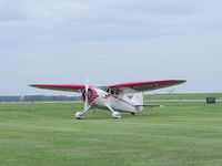 N21117 @ GVQ - Parked on the grass at Batavia. - by Terry L. Swann