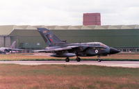 ZA548 @ EGQS - Tornado GR.1, callsign Magnum 4, of RAF Honington's Tactical Weapons Conversion Unit taxying to the active runway at RAF Lossiemouth in the Summer of 1991. - by Peter Nicholson