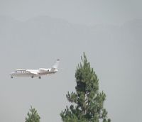 N66VA @ ONT - Over the outer fence on final to runway 26R - by Helicopterfriend