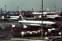 G-APFC @ EGLL - R.R Conway powered BOAC Boeing 707 seen from the Queen's Building at London Heathrow Airport in the early 1970's. Note the new BOAC Boeing 747 and Vickers VC10 aircraft in the background. - by Roger Winser