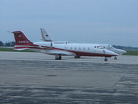 N405TK @ KOSH - Photo taken at dusk on a cloudy evening - by steveowen