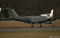 80-23374 @ ORF - RC-12D just after touchdown.  Part of the increased security for the Presidential Visit that day.