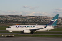 C-FIWS @ CYYC - Boeing 737-700 - by Mark Pasqualino