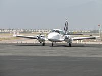 N78JT @ ONT - Pre-flighting before taxiing to runway 26L - by Helicopterfriend