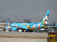 N318AS @ ONT - Just landed on runway 26R and is turning off runway to taxi back to terminal - by Helicopterfriend