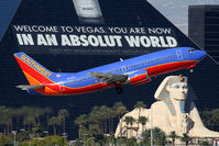 N673AA @ LAS - Southwest Airlines N673AA (FLT SWA2041) climbing out from RWY 1R, passing in front of the Luxor Hotel & Casino, enroute to Albuquerque International Sunport Airport (KABQ). - by Dean Heald