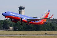 N293WN @ ORF - Southwest Airlines N293WN climbing out from RWY 5 with the control tower in the background.