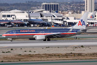 N801NN @ LAX - American Airlines N801NN (FLT AAL1161) exiting RWY 25L after arrival from Chicago O'Hare Int'l (KORD). - by Dean Heald
