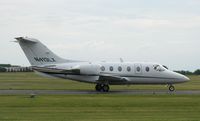 N413LX @ KAXN - Raytheon 400A Beechjet taxiing to runway 13. - by Kreg Anderson