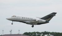 N830FL @ KAXN - Raytheon Hawker 800XP departing runway 13. - by Kreg Anderson