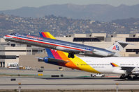 N585AA @ LAX - American Airlines N585AA (FLT AAL2440) departing RWY 25R enroute to Dallas/Fort Worth Int'l (KDFW) with Air Pacific DQ-FJL taxiing in the background. - by Dean Heald