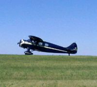 N2277 @ KAXN - WACO ZQC-6 holding short for runway 31. Sorry for the photo, it's off a cell phone. - by Kreg Anderson