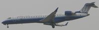 N742SK @ ONT - United Express, eXplus by Sky West on final to Ontario - by Helicopterfriend