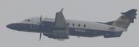 N202UX @ ONT - Heading westbound after lift off from runway 26R on a gloomy morning - by Helicopterfriend
