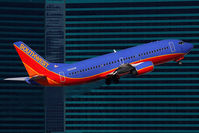 N323SW @ LAS - Southwest Airlines N323SW (FLT SWA1498) climbing out from RWY 1R enroute to Spokane Int'l (KGEG). - by Dean Heald