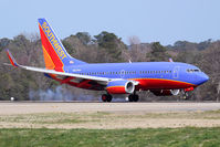 N923WN @ ORF - Southwest Airlines N923WN (FLT SWA254) from Tampa Int'l (KTPA) landing RWY 23 in strong crosswind conditions. You can see than he has right rudder applied and I'm sure left aileron as well, as the plane touches down on the left main gear first. - by Dean Heald