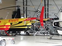 N144PE @ CMA - Parked in a hanger full of Robinso Helicopters - by Helicopterfriend