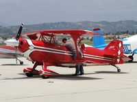 N110BK @ CMA - Checking out radio gear before firing up and taking off - by Helicopterfriend