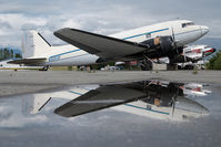 N305SF @ PAAQ - Bush Air Cargo DC3 - reflection