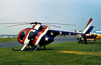 N76HH @ RDG - Appropriate registration and colour scheme for the US Bi-Centennial Celebrations of 1976 for this Hughes 500C on display at the 1976 Reading Airshow. - by Peter Nicholson